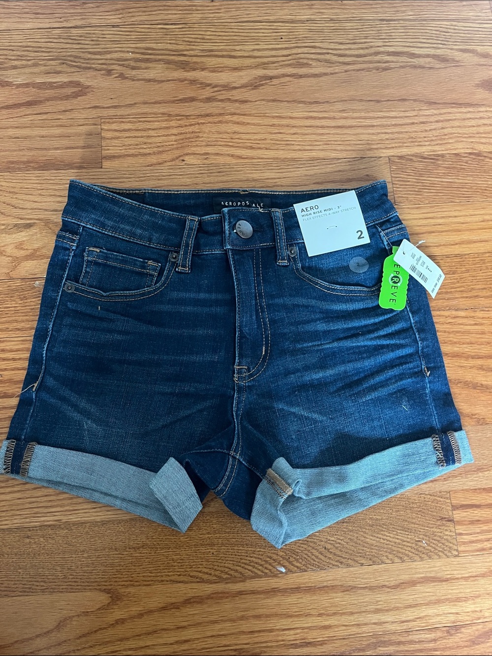Women’s high rise midi dark wash jean shorts